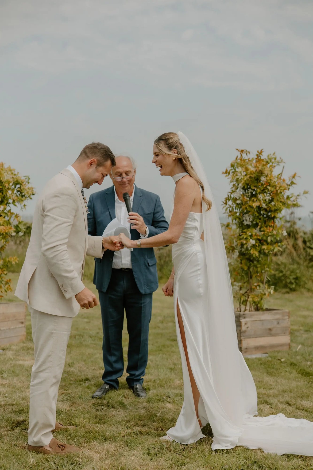 Simon the celebrant readin vows to couple