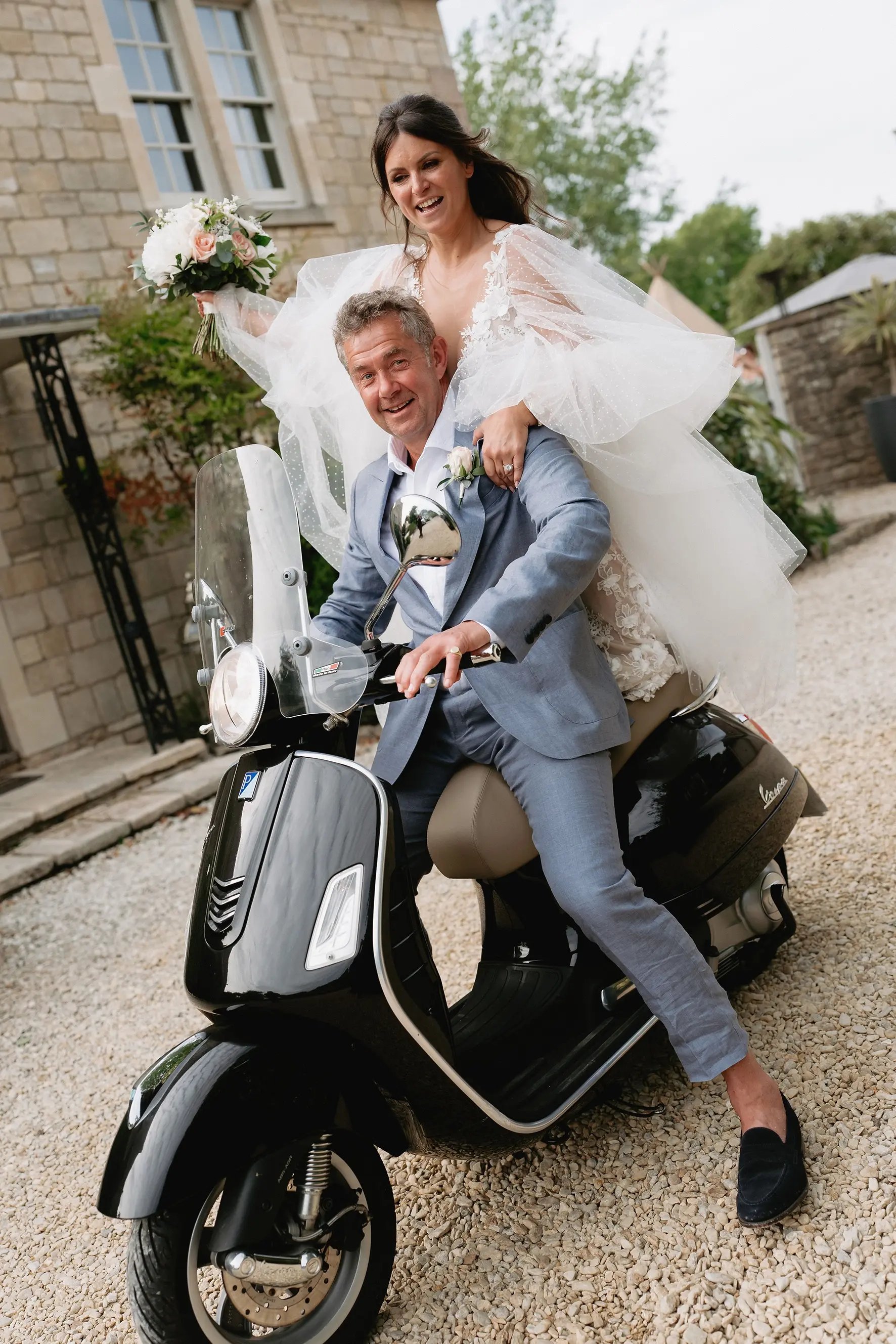 married couple on moped at wedding simon the celebrant